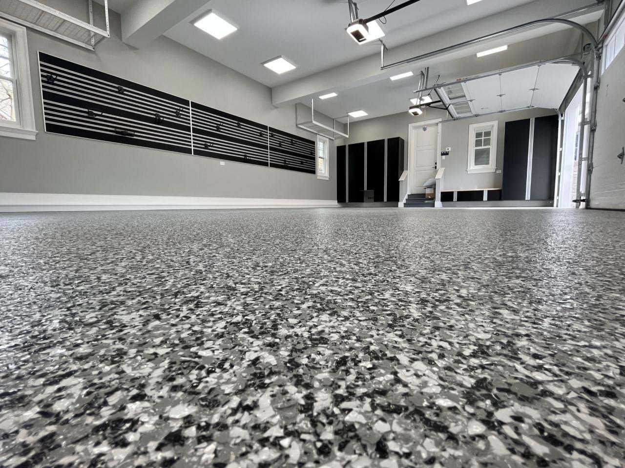 Finished gray epoxy flake floor in a modern garage
